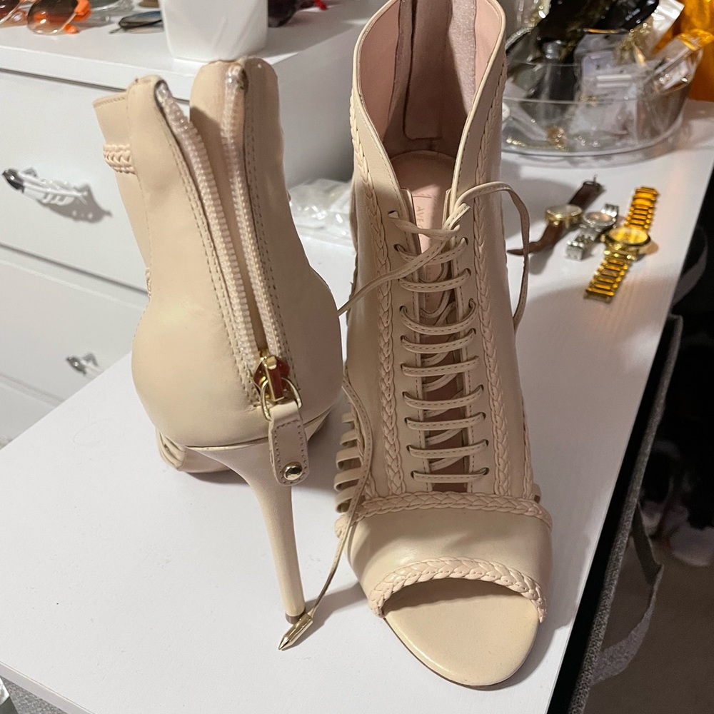 A story told by Joyce Azria Lace-up Cage Stiletto size 11